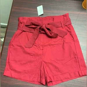 Red shorts with a tie belt